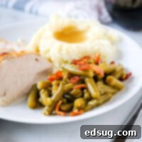 Crispy Bacon Green Beans 6 cropped picture of green beans on plate with turkey and potatoes