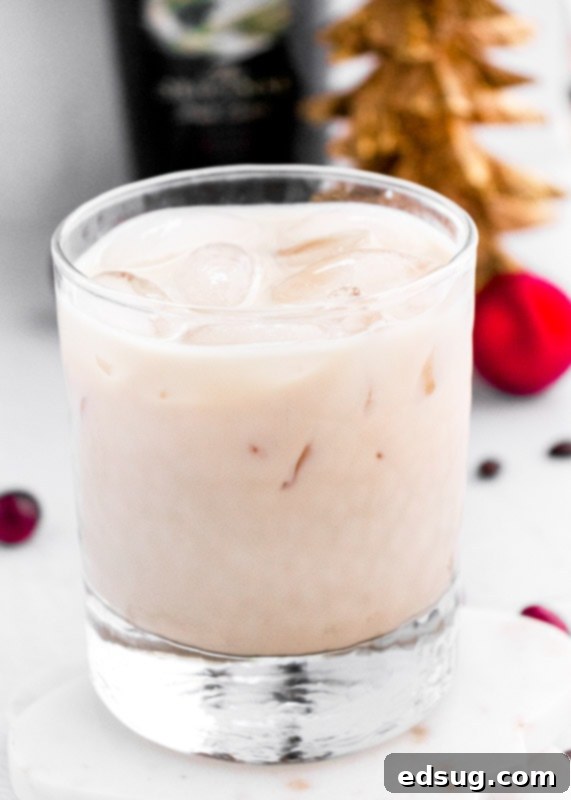 The Perfect Baileys White Russian 2 Close-up of a Baileys White Russian cocktail in a glass with ice, showcasing its creamy layers.