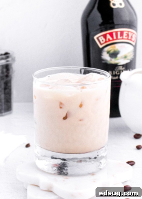 The Perfect Baileys White Russian 4 A freshly made Baileys White Russian cocktail in a glass with melting ice, ready to be enjoyed.
