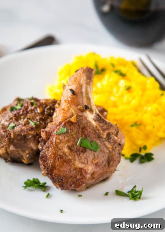 Seared sous vide lamb chops served beautifully on a plate with creamy risotto, ready to be enjoyed.