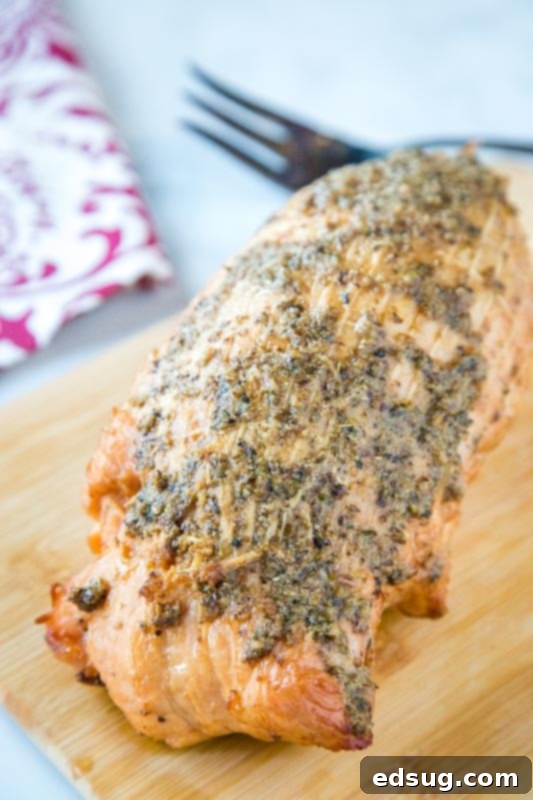 Artisan Smoked Turkey Breast 2 Perfectly sliced smoked turkey breast on a cutting board, ready to serve.