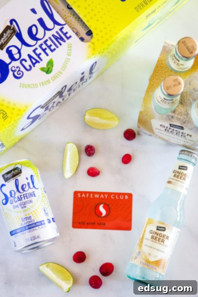 safeway club card with ginger beer, sparkling water, cranberries and lime slices