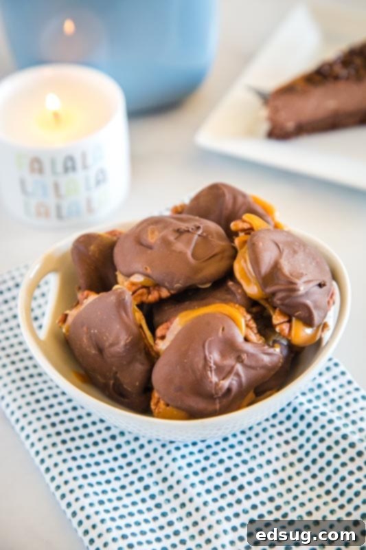 Homemade Turtle Candy in a decorative bowl with a blurred candle in the background, creating a cozy holiday atmosphere.