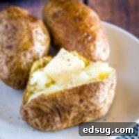 Crispy Air Fryer Baked Potato 8 cropped image of potato with butter on it