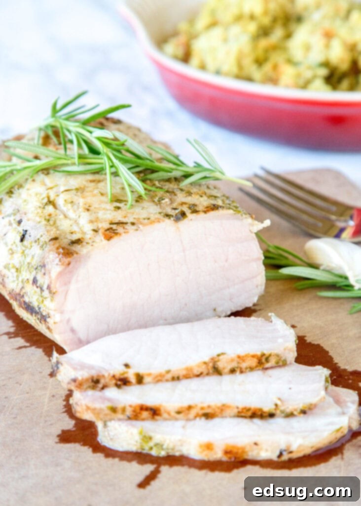 sous vide pork loin on cutting board with 3 slices