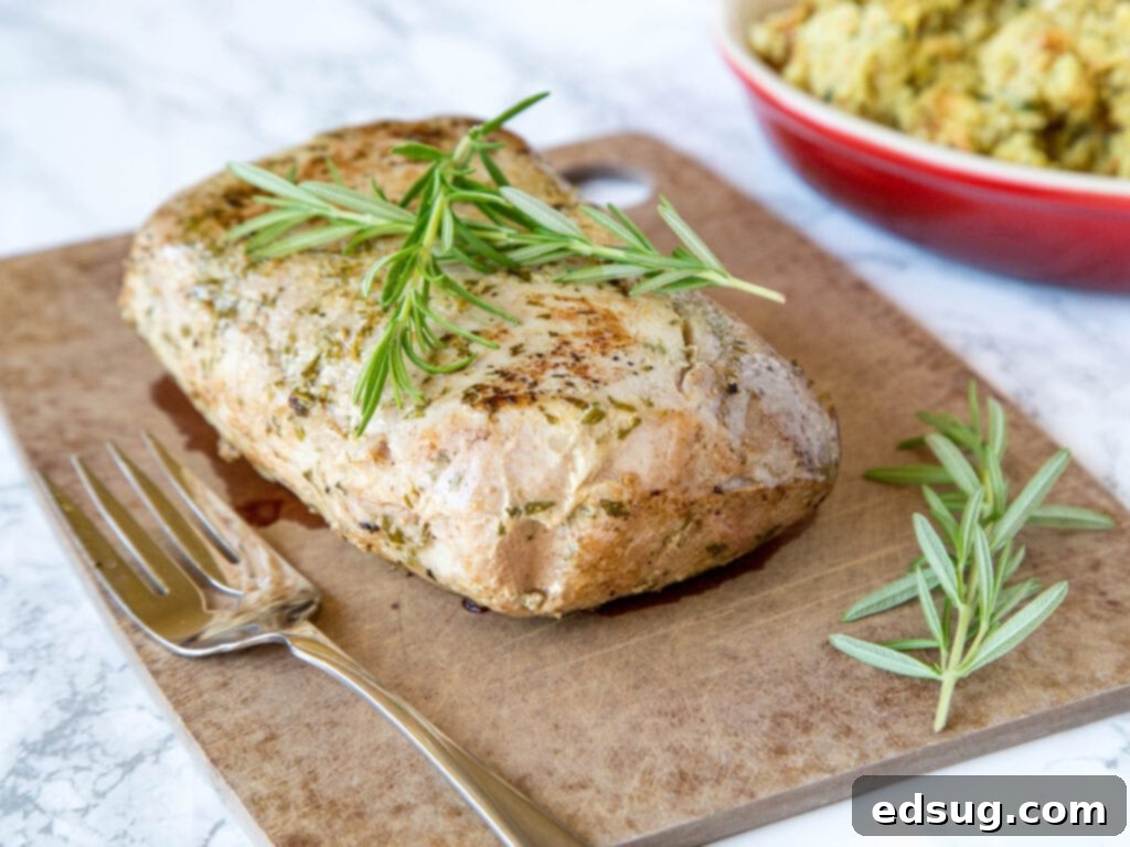 whole pork loin cooked on a cutting board