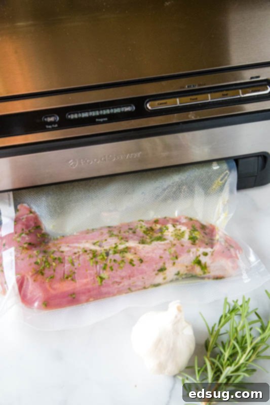 pork tenderloin in vacuum saver bag with rosemary and garlic