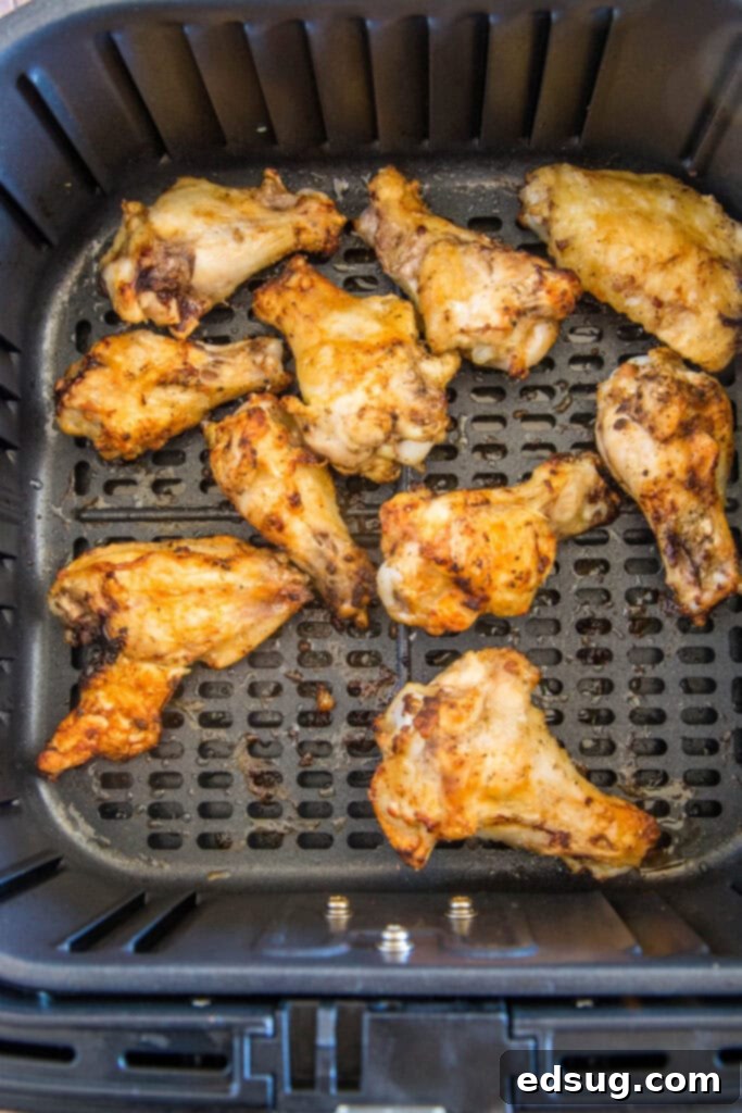 Crispy Air Fryer Chicken Wings 4 chicken wings in air fryer