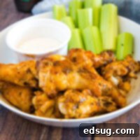 Crispy Air Fryer Chicken Wings 7 cropped image of buffalo chicken wings on plate with ranch and celery sticks