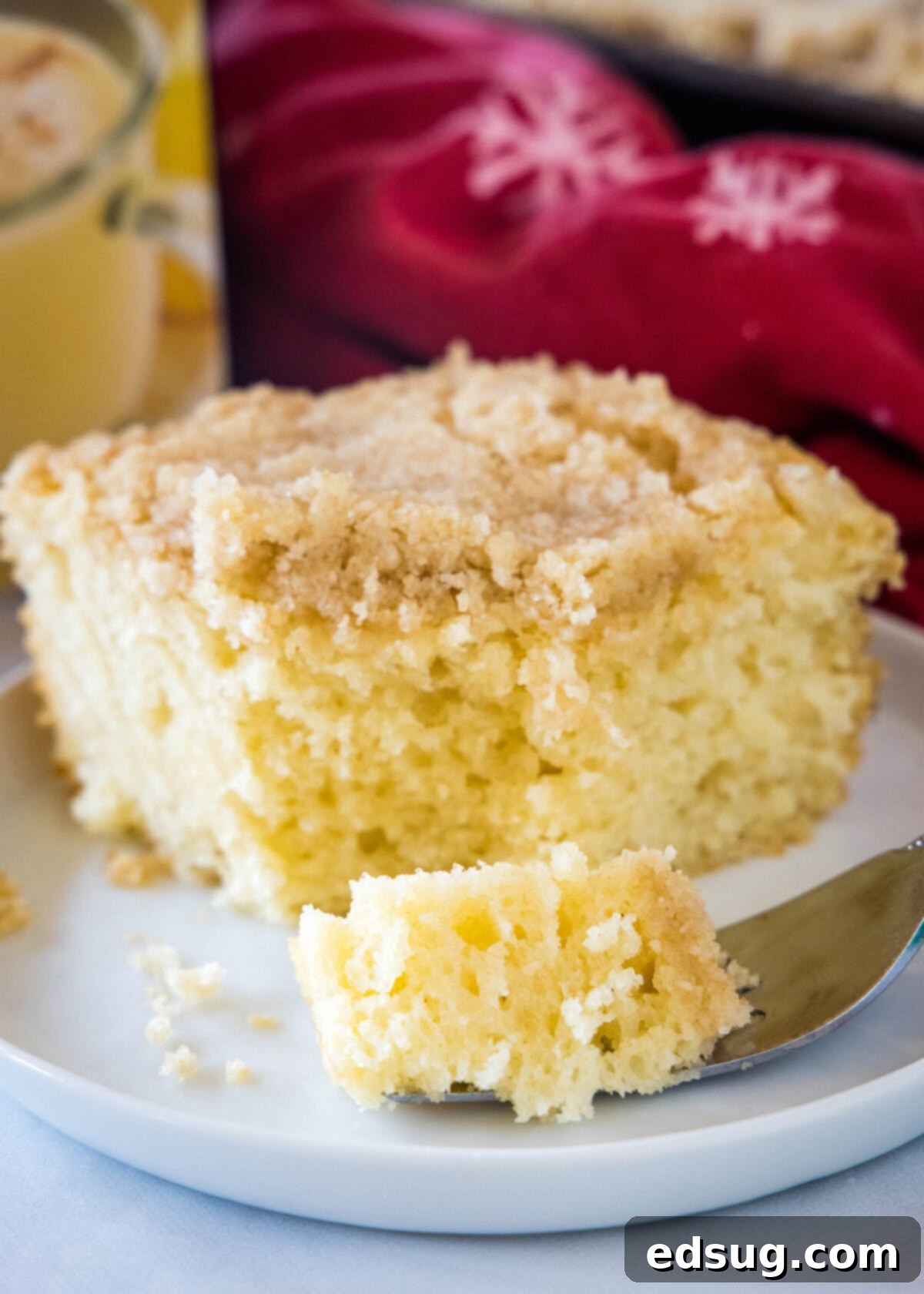 Eggnog Coffee Cake eggnog coffee cake with a bite of it on a fork