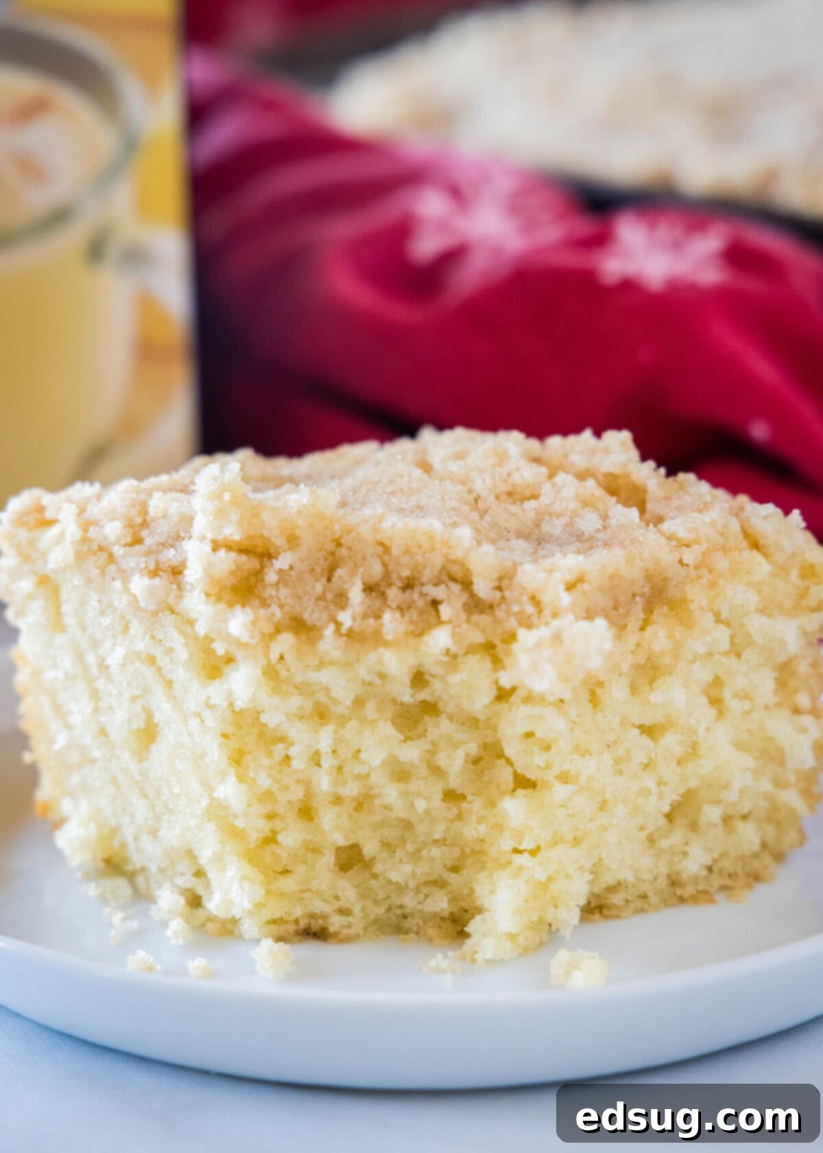 Festive Eggnog Crumb Cake 3 eggnog coffee cake on a plate