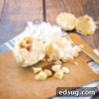 roasted garlic cloves on cutting baord