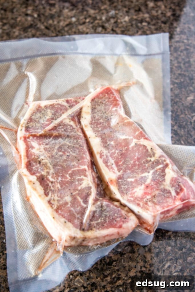 Sous Vide Steak Perfection 3 raw steak seasoned and securely sealed in a vacuum bag, ready for a sous vide water bath