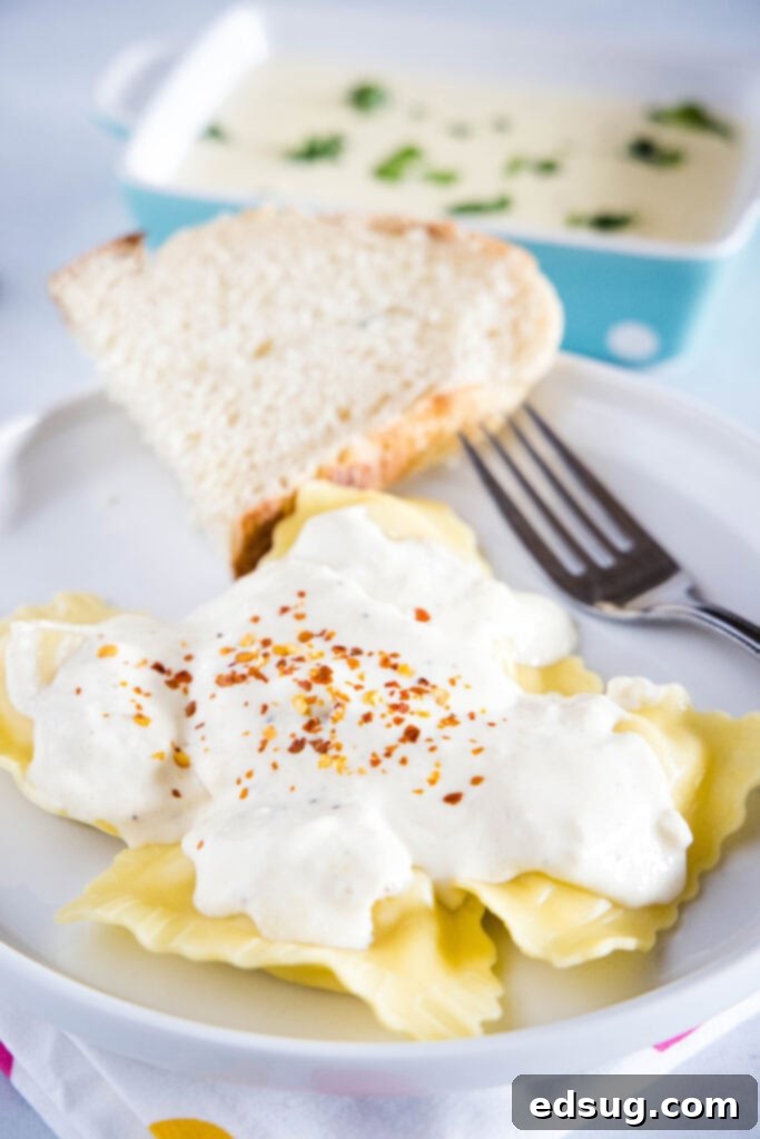 ravioli topped with roasted garlic cream sauce