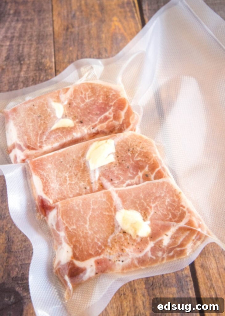 Effortlessly Perfect Sous Vide Pork Chops 4 Raw pork chops seasoned and vacuum-sealed in a food saver bag, ready for a sous vide water bath.