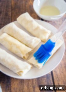 Perfect Air Fryer Egg Rolls 16 brush egg rolls with oil before putting in the air fryer