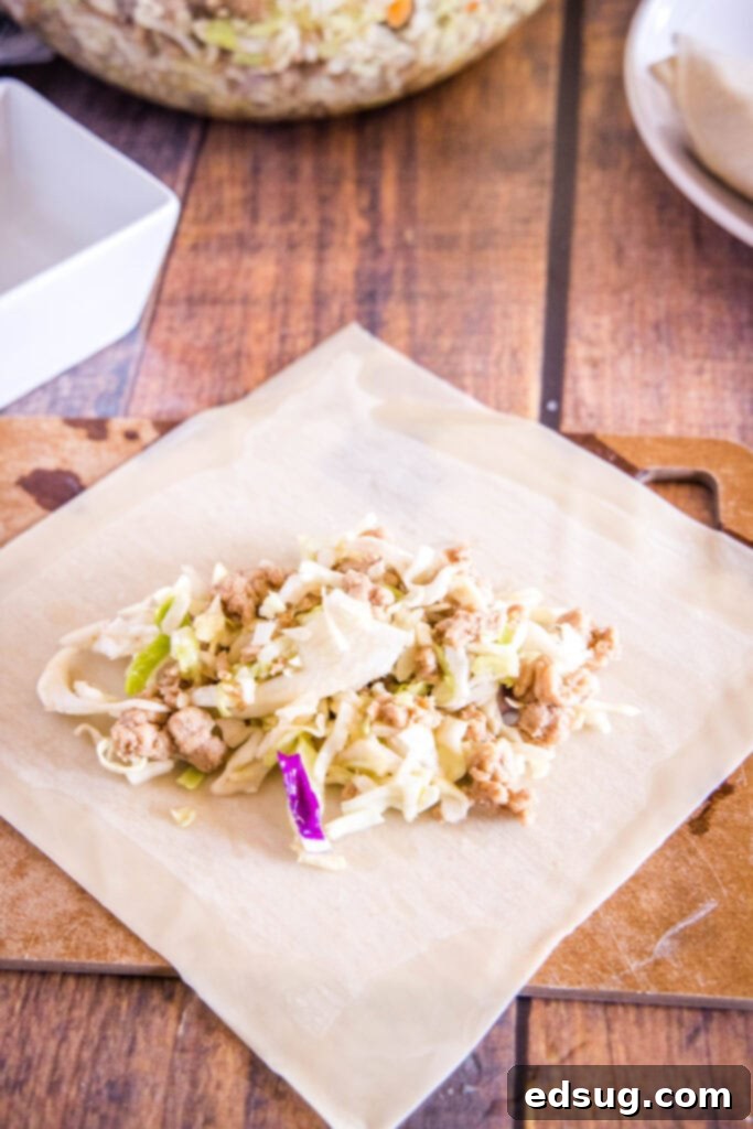 Perfect Air Fryer Egg Rolls 5 filling an egg roll wrapper