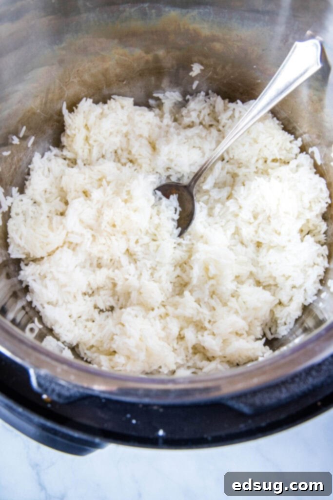 Perfect Instant Pot Jasmine Rice 5 jasmine rice cooked in the instant pot fluffed and ready to serve, showcasing perfect texture