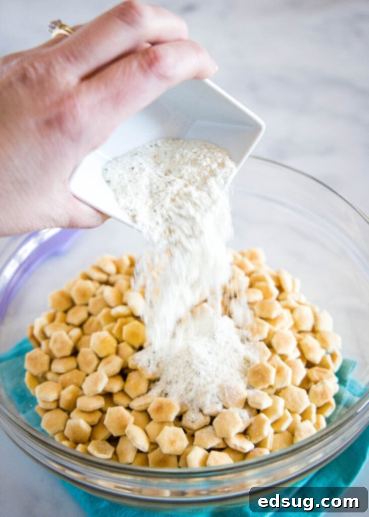 pour ranch dressing mix on crackers