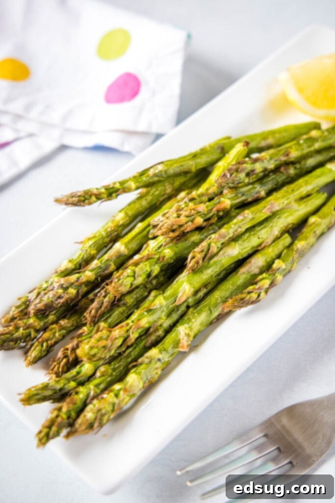 Tender-Crisp Air Fryer Asparagus 2 looking down on a plate of air fryer asparagus