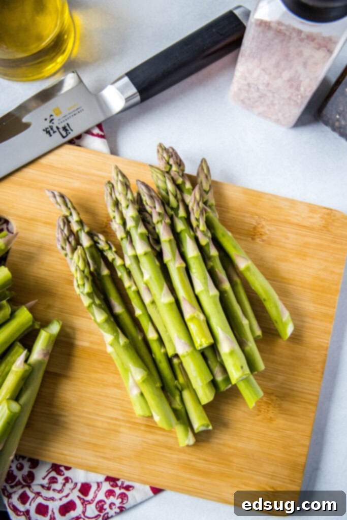 Tender-Crisp Air Fryer Asparagus 3 chopped asparagus on a cutting board