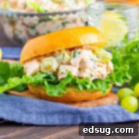 Close up of a delicious chicken salad sandwich, highlighting the textures and ingredients.