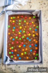Colorful M and M Brownies 11 M&M brownies in pan ready for the oven