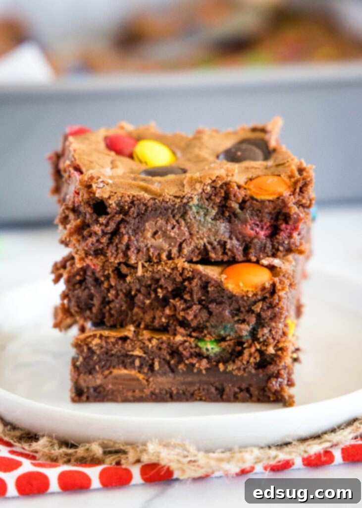 Colorful M and M Brownies 4 Stack of brownies with M&M's on a white plate
