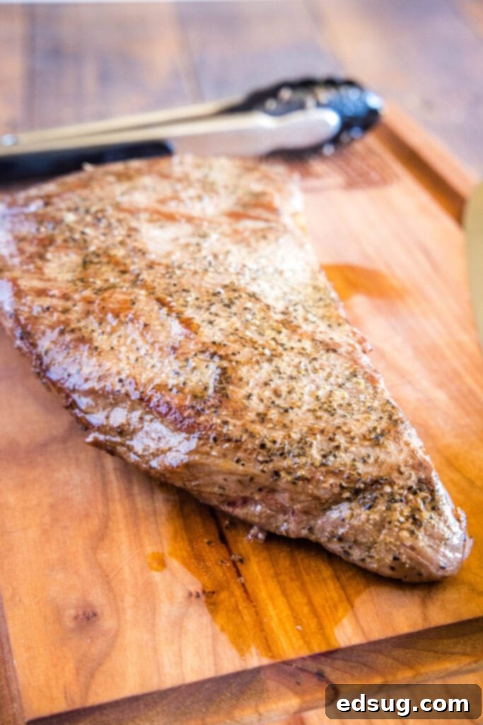 fully cooked and seared tri tip on cutting board