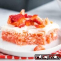 close up strawberry brownies with bite taken out of.