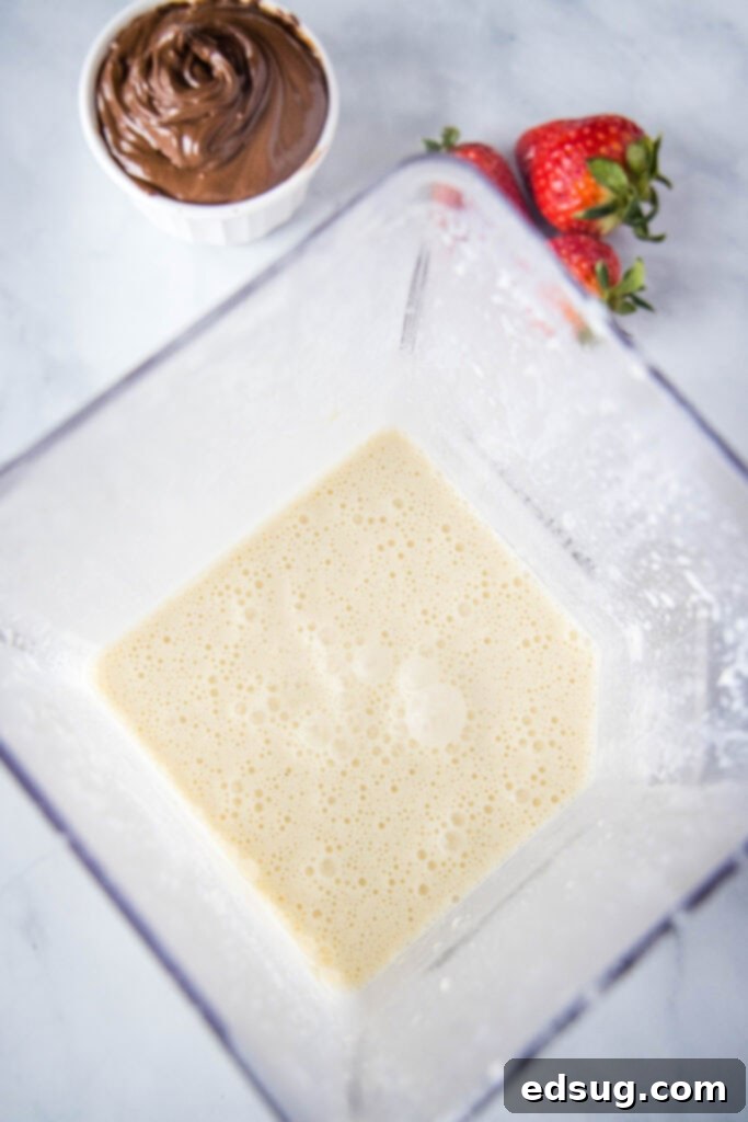crepe batter being mixed in a blender