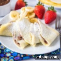 close up of crepes filled with nutella on a plate