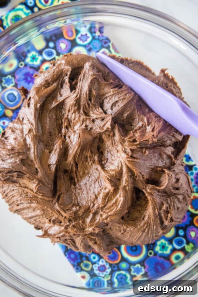 No-Fuss Chocolate Frosting 2 looking down on a bowl of chocolate buttercream frosting, rich and creamy