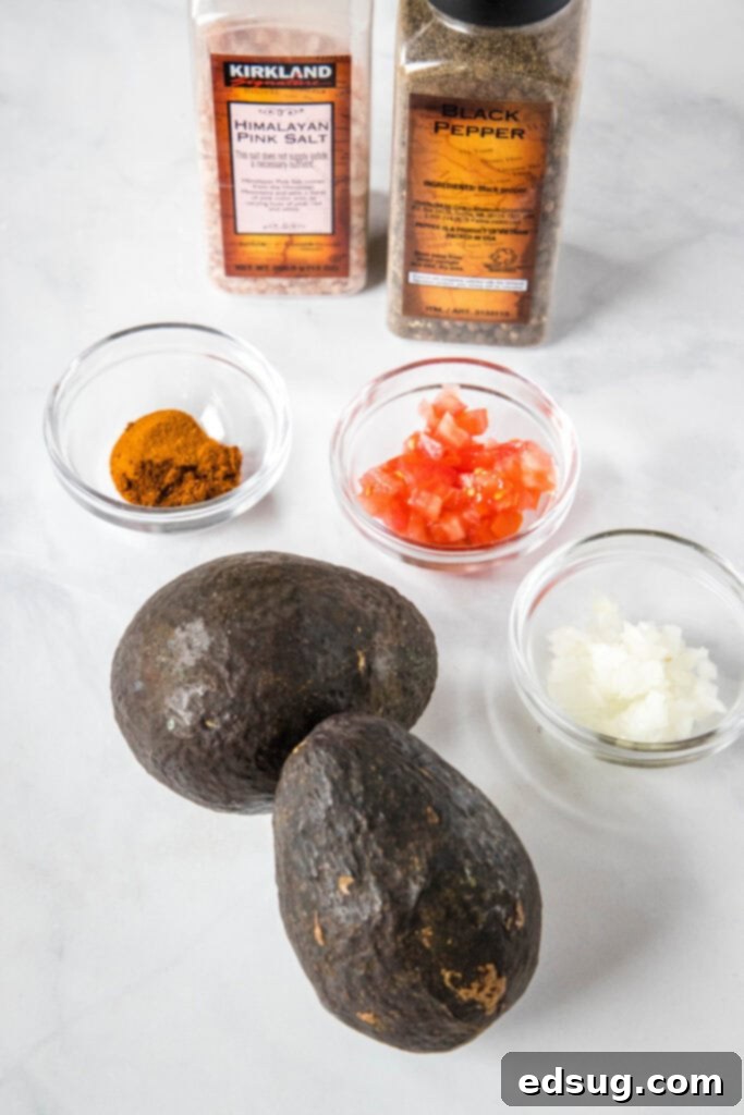 guacamole ingredients laid out on a board