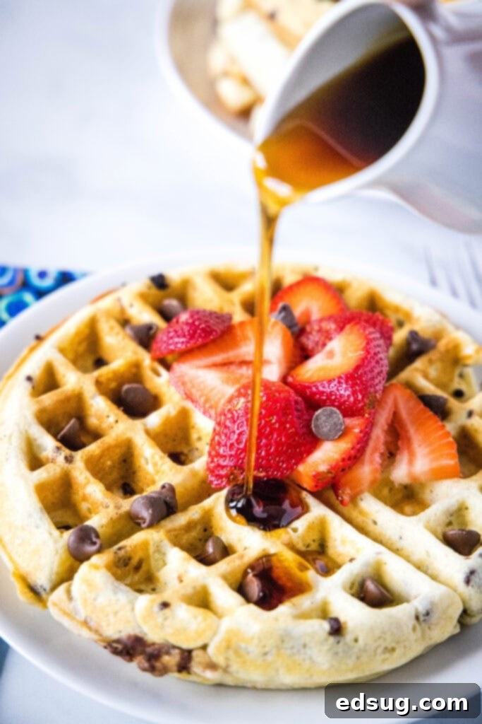 Decadent Chocolate Chip Waffles 2 pouring syrup onto chocolate chip waffles