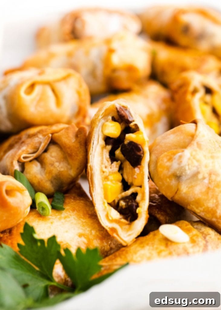 Canyon Crunch Rolls 4 egg roll cut open to show filling