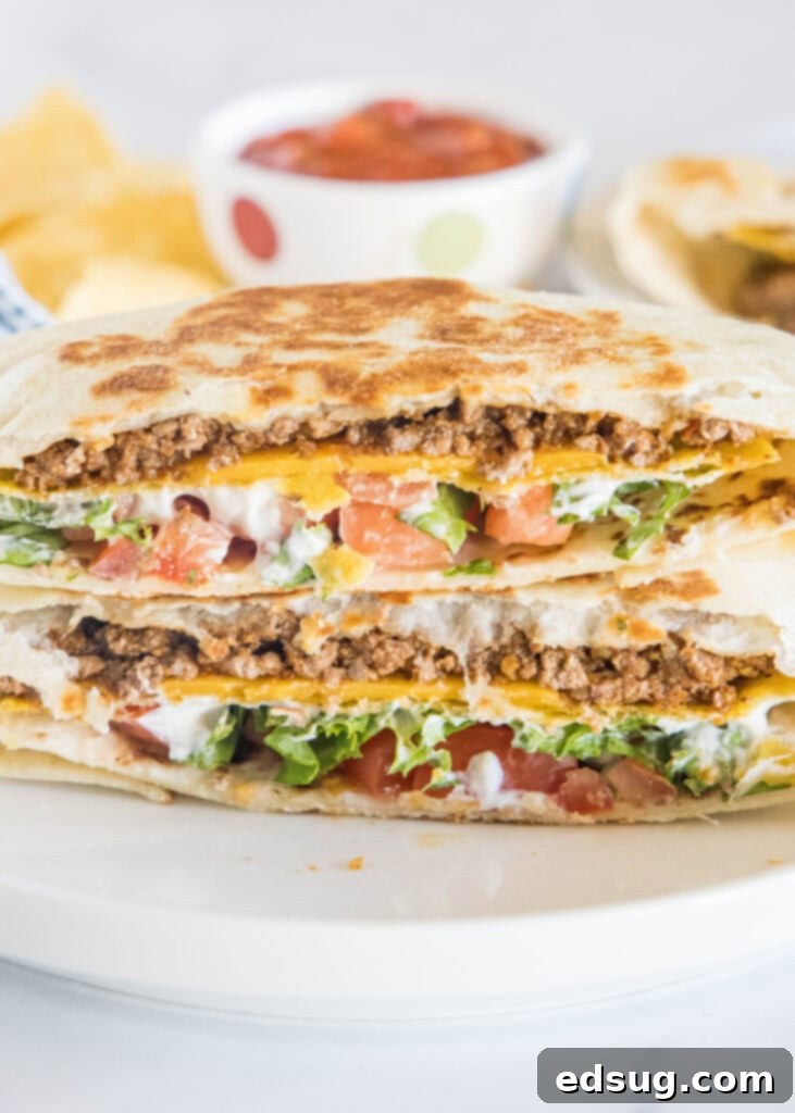 Ultimate Crispy Wrap 3 Homemade Crunchwrap Supreme, sliced open to reveal internal layers