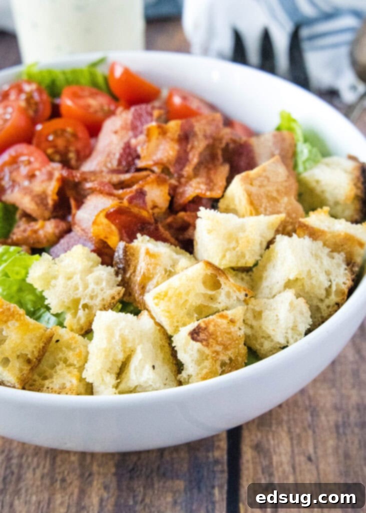 Crispy Homemade Croutons 2 Homemade croutons scattered on a vibrant green salad