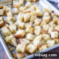 close up of bread cubes on a baking tray