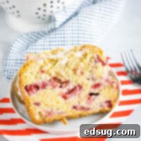 close up of a slice of strawberry bread on a plate