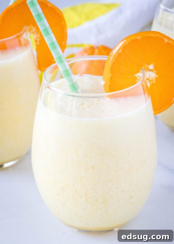 Homemade Orange Julius Perfection 2 a glass of copycat orange julius with an orange slice