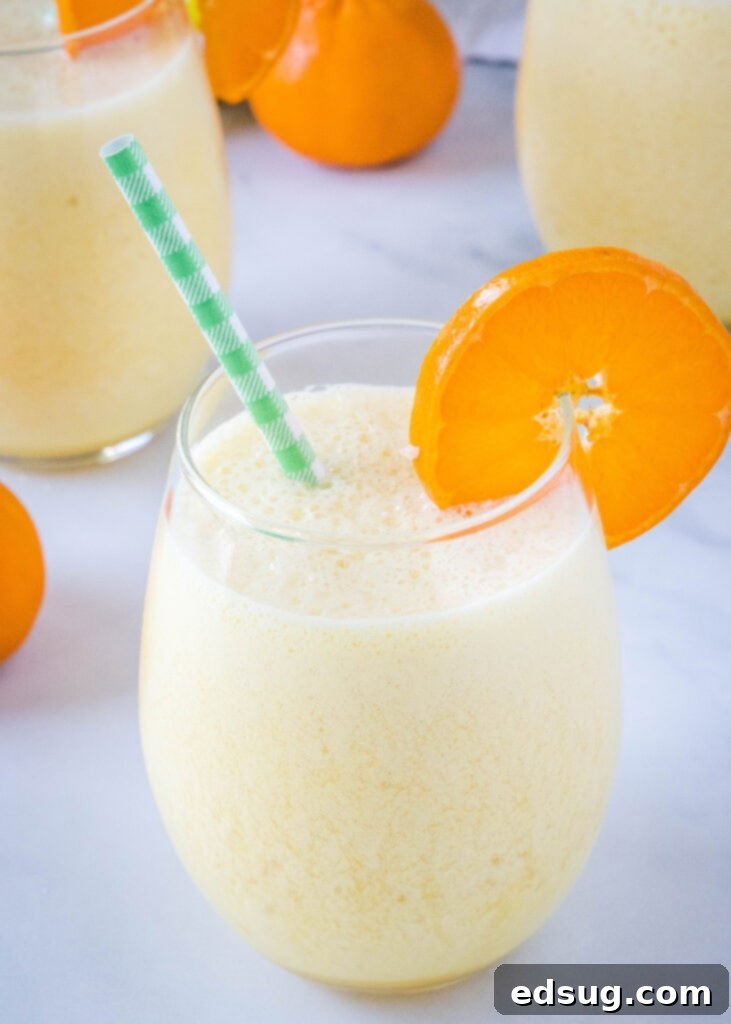 Homemade Orange Julius Perfection 5 orange julius copycat in a glass with a straw