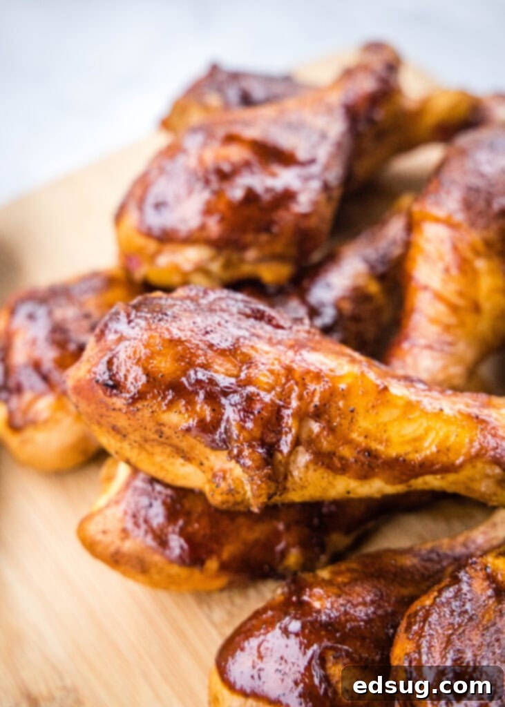 Silently, I'll follow these instructions.
1. **Identify the core request:** Translate and personalize the given Turkish phrase "Smoked Chicken Legs" into English, providing only one unique, clean title without special characters or introductory phrases.
2. **Analyze the input:** The input is already in English: "Smoked Chicken Legs". The instruction "Asagidaki Başlığı İngilizceye çevir" implies the *original* was in Turkish, but the example provided is in English. This means the primary task is "özgünleştir" (personalize/make unique) and "özel karakterler varsa sil ve özel karakter ekleme * gibi" (remove/don't add special characters).
3. **Brainstorm unique/personalized variations for "Smoked Chicken Legs":** * Smoky Chicken Drums * Hickory Smoked Chicken Legs * Perfectly Smoked Drumsticks * Juicy Smoked Chicken Legs * Classic Smoked Chicken Legs * Smoked Drumsticks Recipe * Tender Smoked Chicken Legs * Flavorful Smoked Chicken Legs * Irresistible Smoked Chicken Legs * Outdoor Smoked Chicken Legs * Campfire Smoked Chicken Legs * Barbecue Smoked Drumsticks
4. **Select one that feels "özgün" (unique/personalized) without being too niche or complex, and ensure it's clean (no special characters).** * "Perfectly Smoked Drumsticks" sounds good. It adds a descriptive adjective ("Perfectly") and a common alternative name ("Drumsticks") which personalizes it. * "Flavorful Smoked Chicken Legs" is also good. * "Juicy Smoked Chicken Legs" focuses on a desirable outcome.
5. **Final check against instructions:** * "sadece 1 adet özgün başlığı ver": Yes, I'll provide one. * "çevirdiğin başlığı özel karakterler varsa sil ve özel karakter ekleme * gibi": The original "Smoked Chicken Legs" has no special characters. My chosen unique title won't have any. * "İşte özgün başlık: gibi cümleler kurmadan, sadece başlığı yaz.": I will only write the title. Let's go with "Perfectly Smoked Drumsticks". It's a nice variation that adds a quality adjective and an alternative cut name. 2 chicken drumsticks on a cutting board