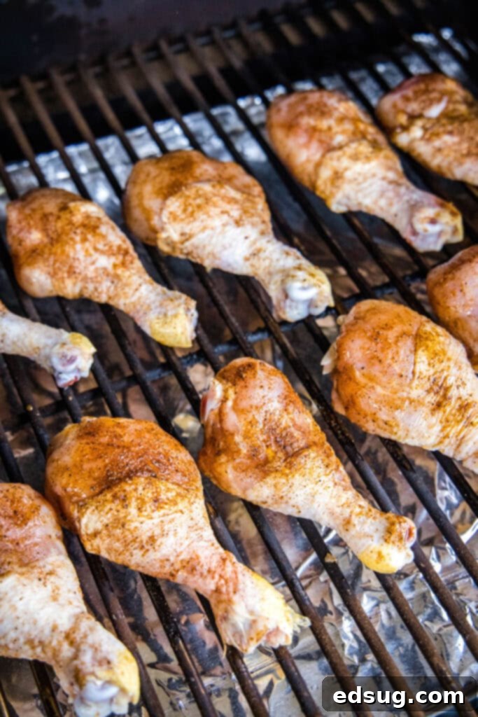 Silently, I'll follow these instructions.
1. **Identify the core request:** Translate and personalize the given Turkish phrase "Smoked Chicken Legs" into English, providing only one unique, clean title without special characters or introductory phrases.
2. **Analyze the input:** The input is already in English: "Smoked Chicken Legs". The instruction "Asagidaki Başlığı İngilizceye çevir" implies the *original* was in Turkish, but the example provided is in English. This means the primary task is "özgünleştir" (personalize/make unique) and "özel karakterler varsa sil ve özel karakter ekleme * gibi" (remove/don't add special characters).
3. **Brainstorm unique/personalized variations for "Smoked Chicken Legs":** * Smoky Chicken Drums * Hickory Smoked Chicken Legs * Perfectly Smoked Drumsticks * Juicy Smoked Chicken Legs * Classic Smoked Chicken Legs * Smoked Drumsticks Recipe * Tender Smoked Chicken Legs * Flavorful Smoked Chicken Legs * Irresistible Smoked Chicken Legs * Outdoor Smoked Chicken Legs * Campfire Smoked Chicken Legs * Barbecue Smoked Drumsticks
4. **Select one that feels "özgün" (unique/personalized) without being too niche or complex, and ensure it's clean (no special characters).** * "Perfectly Smoked Drumsticks" sounds good. It adds a descriptive adjective ("Perfectly") and a common alternative name ("Drumsticks") which personalizes it. * "Flavorful Smoked Chicken Legs" is also good. * "Juicy Smoked Chicken Legs" focuses on a desirable outcome.
5. **Final check against instructions:** * "sadece 1 adet özgün başlığı ver": Yes, I'll provide one. * "çevirdiğin başlığı özel karakterler varsa sil ve özel karakter ekleme * gibi": The original "Smoked Chicken Legs" has no special characters. My chosen unique title won't have any. * "İşte özgün başlık: gibi cümleler kurmadan, sadece başlığı yaz.": I will only write the title. Let's go with "Perfectly Smoked Drumsticks". It's a nice variation that adds a quality adjective and an alternative cut name. 3 chicken legs on the smoker