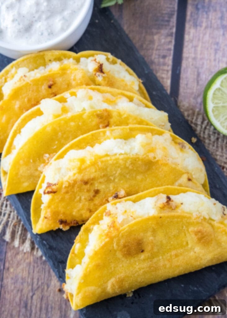 looking down on a tray with crispy potato tacos