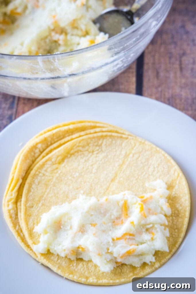 filling tortillas with mashed potatoes