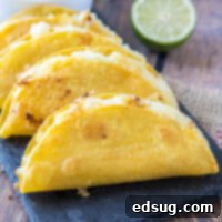 close up of crispy potato tacos on a tray