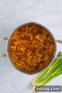 egg ribbons in pot of soup