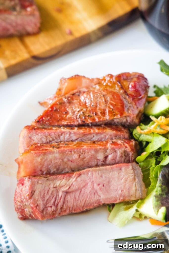 smoked steak on a plate with salad
