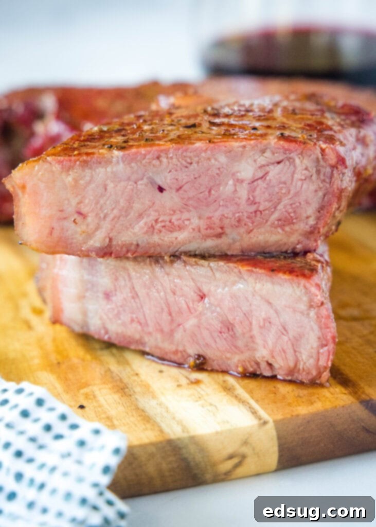 a steak cut in half on a cutting board